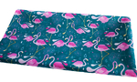 Waterproof fabric - flamingos on an emerald 