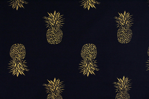 Golden pineapples on dark navy blue 